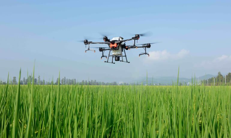 product shot of the DJI t-20 drone in mid flight
