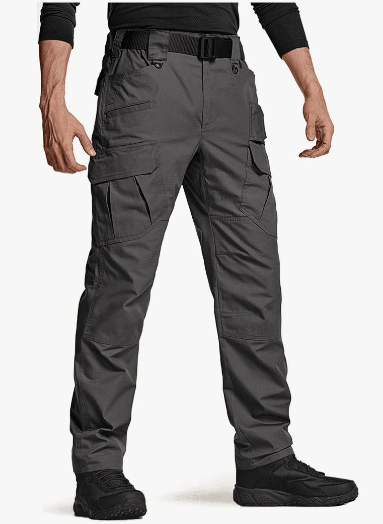 A man wearing a black shirt and shoes with gray cargo work pants