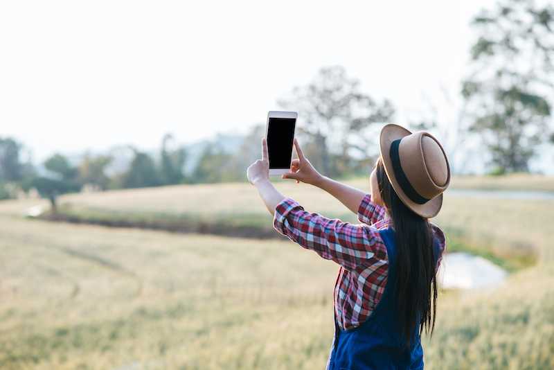 rancher with tablet in field
