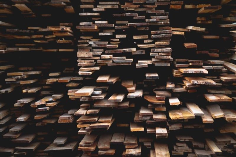 Wooden planks stacked on top of one another.