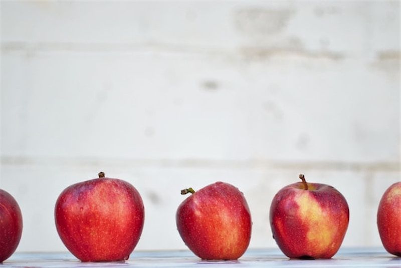 a row of red delicious apples